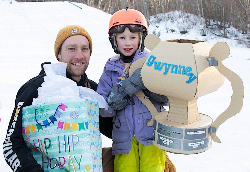 Gwynne Valley Ski Area held its annual cardboard toboggan races on Feb. 15. Pictured here, Regan and Jasper Bueckert won the family category race and hold up the &lsquo;Gwynney&rsquo; trophy. (Photo by Sarah Caissie)